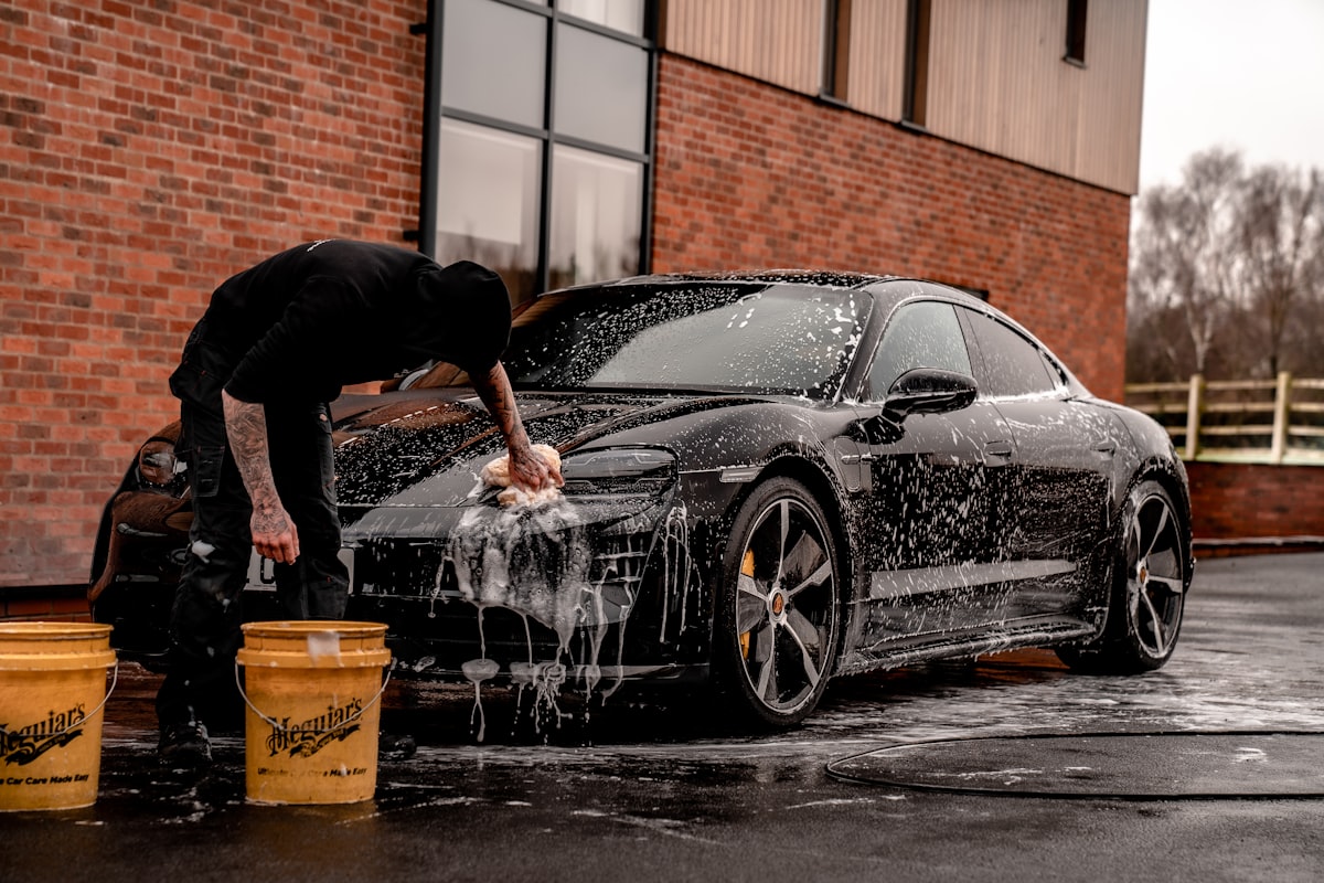 Washing a car at the on-site wash and vacuum area